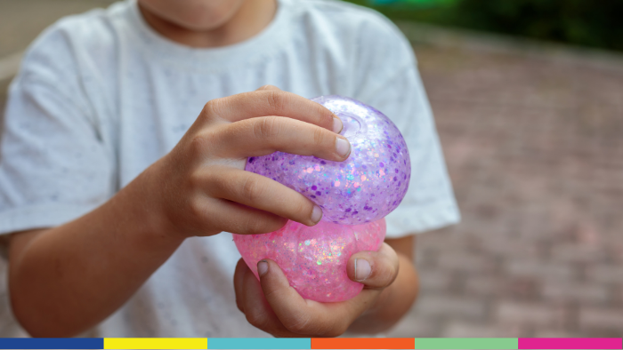 Child playing with a squishy toy